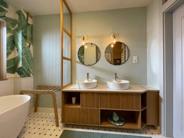 Double bathroom for two. Plant pattern on the walls.